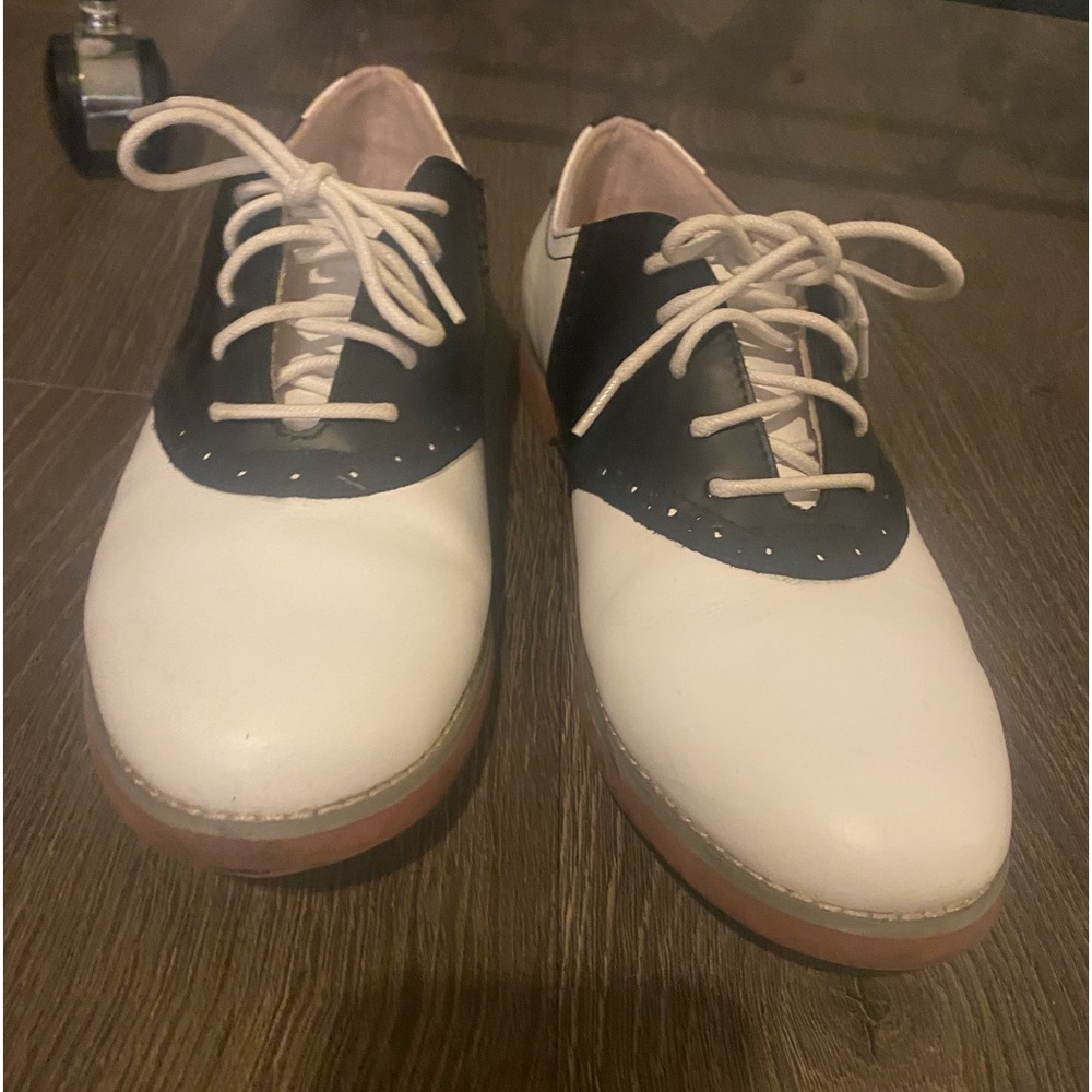 White and black loafers